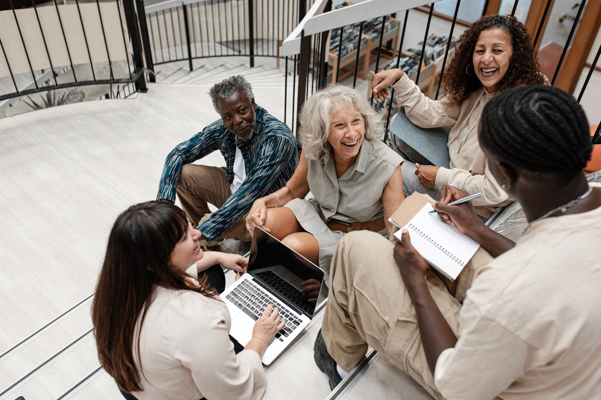 Group of Adult Students Studying in the Library 